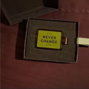 “Never Change” money clip by easy tiger.1 3/4 inches wide, green and gun metal.